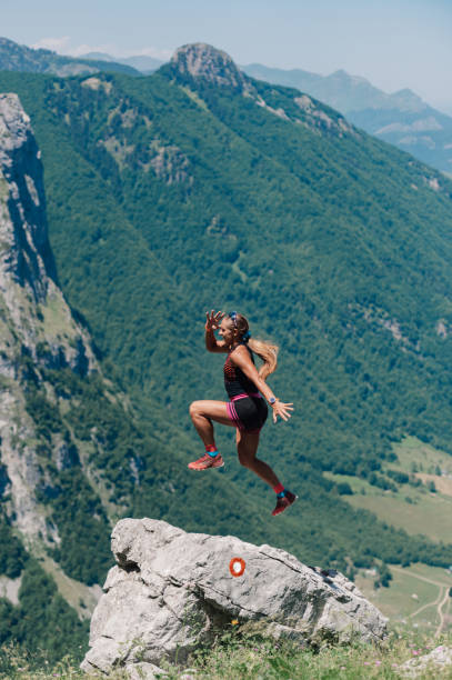 istock An extreme sportswoman is practicing skyrunning in rocky mountains. 2011490604