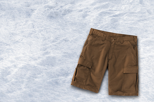 Brown cargo shorts on a snow background