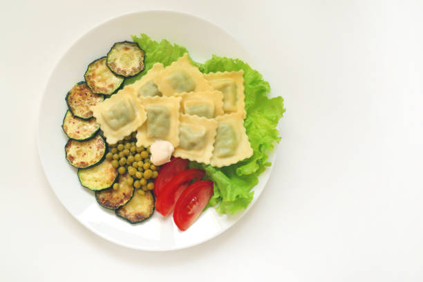 Vegan plate with delicious ravioli and vegetables