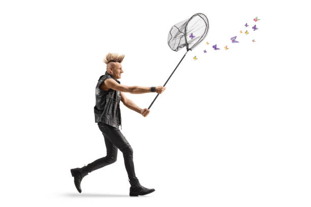 istock Punk in leather clothes running and catching butterflies with a net 2011587336