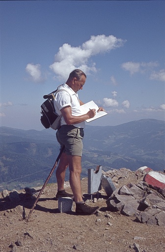 Carinthia, Austria, 1963. When he arrives at his destination, a hiker signs his name in the summit book.