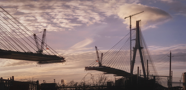 The Gordie Howe International Bridge, is expected to be fully constructed and open for business by 2024/2025.   The bridge will link Detroit, Michigan with Windsor, Ontario.