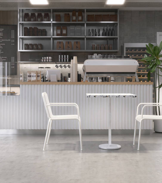 istock White table and chairs in modern loft, white brick wall cafe and bakery shop with counter, professional espresso machine, cake display fridge 2011657437
