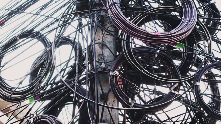 Messy hanging electricity cables in the street