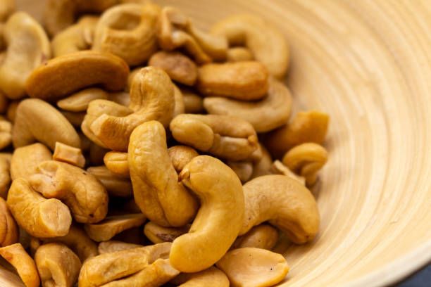 istock Close Up on Cashew Nuts in a bamboo bowl. 2011698791