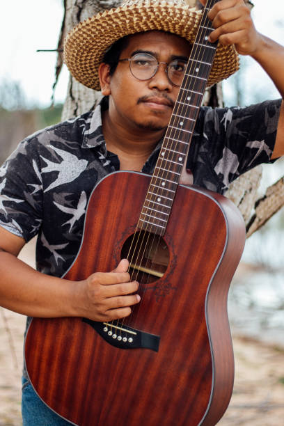 istock cute male musician 2011717885