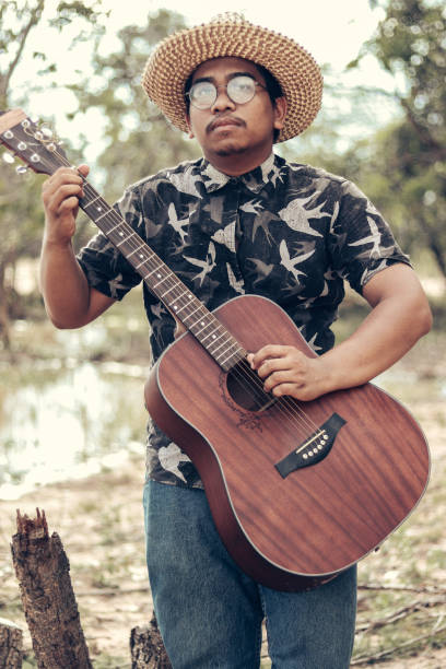 istock cute male musician 2011721656