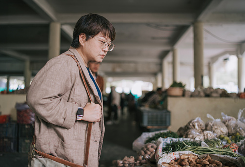 experiential travel asian Chinese tourist exploring Bhutan Paro farmer's market