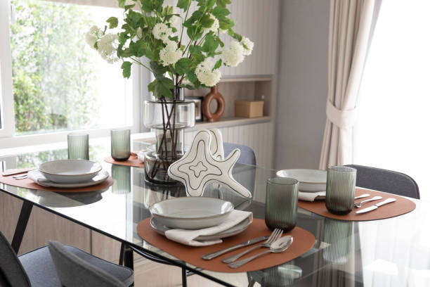 istock White and brown plate setting on dinning table in a dining room 2011729495
