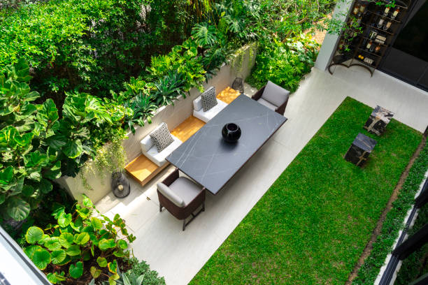 istock Backyard outdoor garden patio with modern wicker sofa and pillow. 2011731575
