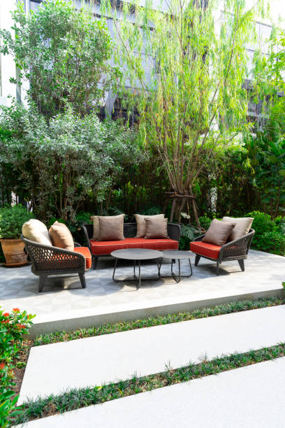 istock Backyard outdoor garden patio with modern wicker sofa and pillow. 2011731580
