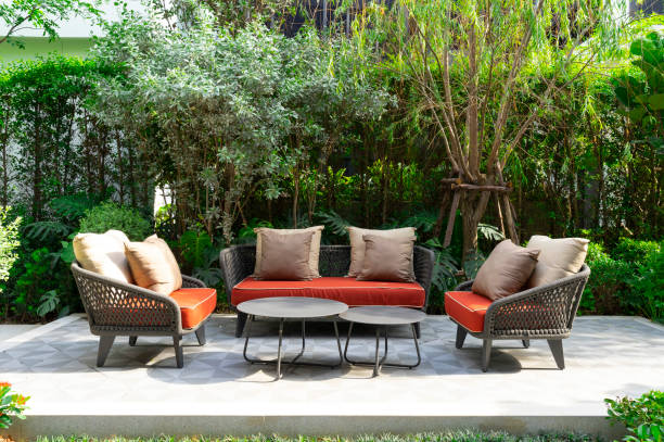 istock Backyard outdoor garden patio with modern wicker sofa and pillow. 2011731584