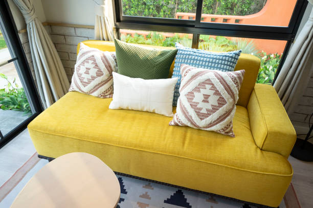 istock Yellow sofa and pillow in small interior space. 2011732100