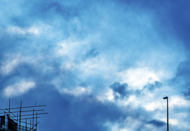 Street light and scaffolding in a winter sky