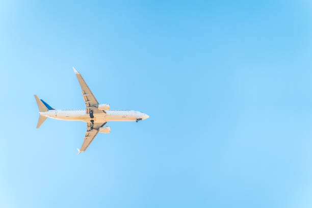 Airplane before landing in blue sky, Boeing 737-800