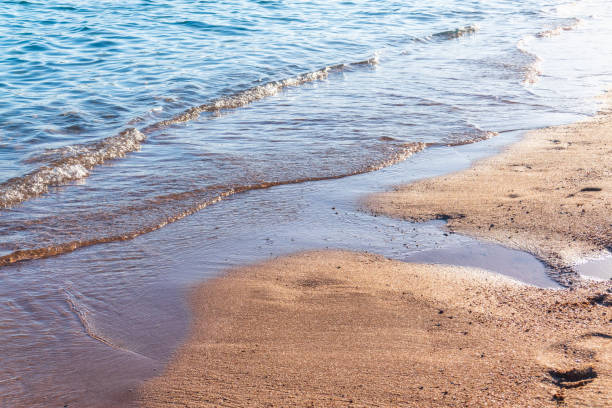 istock Soft wave of the sea on the sandy beach. 2011760053