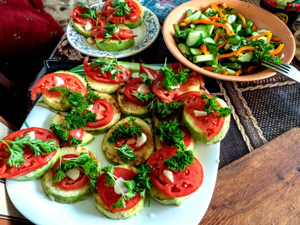 delicious bright vegetable snacks zucchini, tomatoes on plates