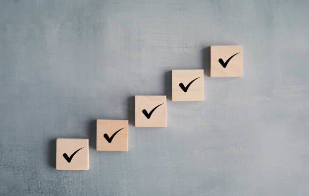 istock Checklist, Task list, Survey and assessment, Ladder of success concept. Correct check mark on step of wooden blocks. 2011866445