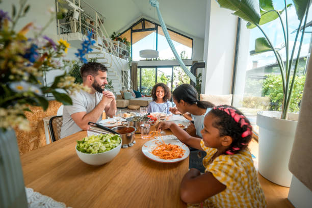 istock Joyful Family Eating at Home 2011900111