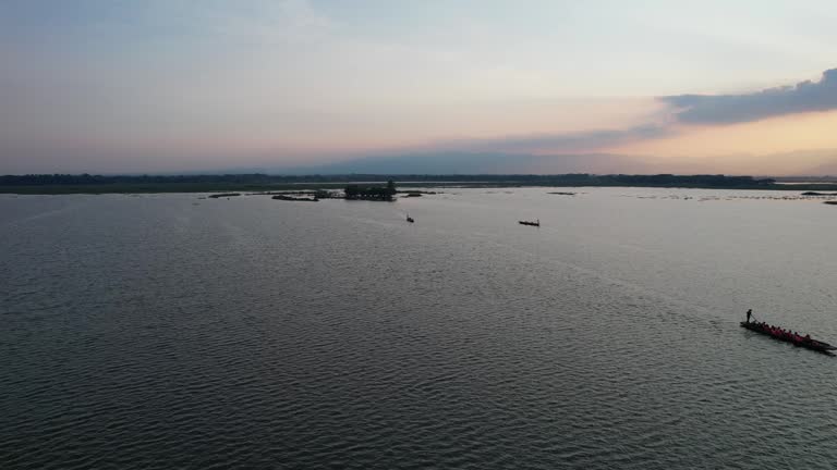 Aerial view of row boat in Phayao lake before sunset by drone