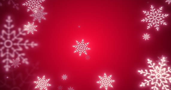 Christmas festive bright New Year background made of white glowing winter beautiful falling flying snowflakes patterns on a red background.