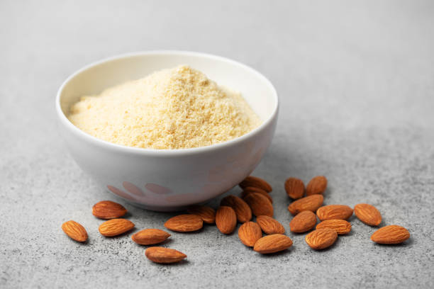 istock Fresh almond flour in a  bowl and almonds 2011945777