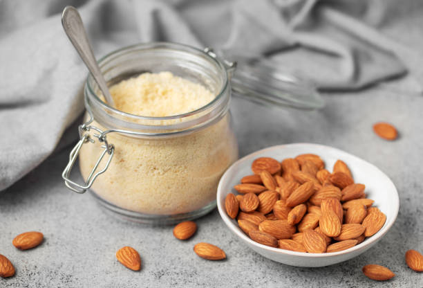 istock Fresh almond flour in a  glass jar and almonds 2011946001