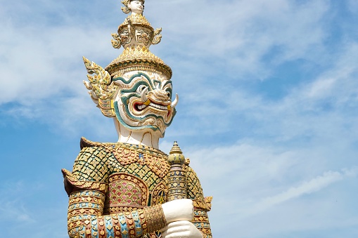 Close-up of Sahatsadecha, one of two giant statues - characters from the Ramakien epic - guarding the rear Koei Sadet Gate of the Wat Phra Kaew or Temple of the Emerald Buddha in Bangkok, Thailand