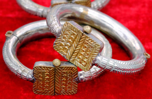 A display of Navajo culture silver and stone bracelets for sale at a vintage flea market