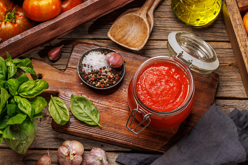 Rich homemade tomato sauce and ingredients