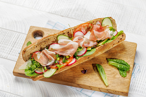 Delicious sandwich stuffed in a fresh baguette, bursting with flavor and wholesome ingredients