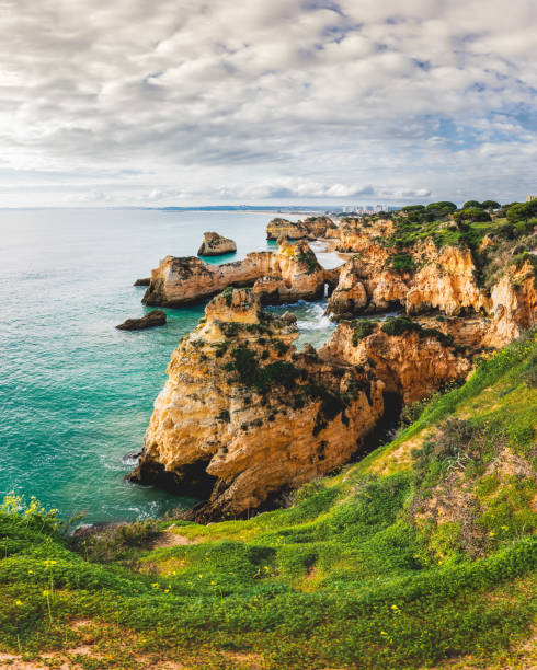 istock Rugged shoreline with cliffs and caves, set against the backdrop of the Atlantic Ocean's waves crashing on the rocks. 2012041935