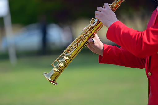 Playing soprano saxophone in outdoor