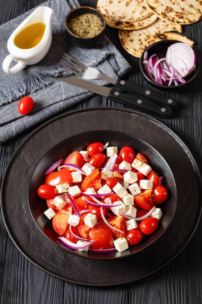 istock tomato salad with red onion and white cheese 2012084988