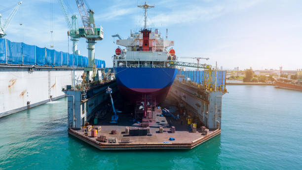 istock Cargo container ship at dry dock concept maintenance service. working at dry dock. Insurance and Maintenance Crude tanker Ship concept. Freight Forwarding Service maintenance Insurance. 2012113439