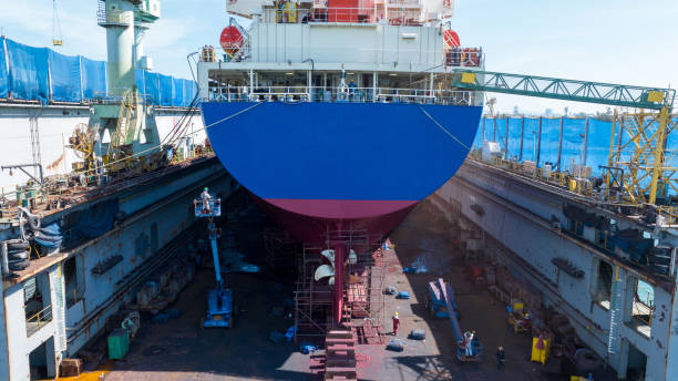 istock Cargo container ship at dry dock concept maintenance service. working at dry dock. Insurance and Maintenance Crude tanker Ship concept. Freight Forwarding Service maintenance Insurance. 2012113947