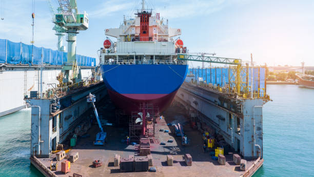 istock Cargo container ship at dry dock concept maintenance service. working at dry dock. Insurance and Maintenance Crude tanker Ship concept. Freight Forwarding Service maintenance Insurance. 2012113962