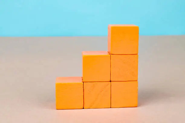 Orange wooden blocks stacked vertically