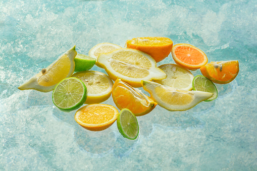 Citrus background. Assorted fresh citrus fruits with leaves. Lemon, orange, lime, grapefruit, tangerine. Health concept. Vitamin C. Top view