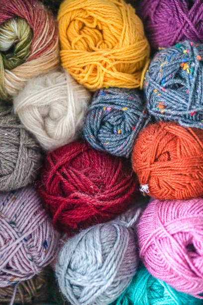 istock Colorful yarn skeins close up, stacked 2012164034