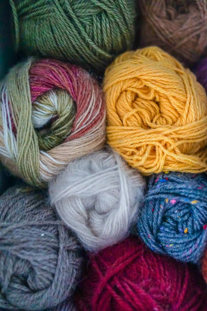 istock Colorful yarn skeins close up, stacked 2012164035