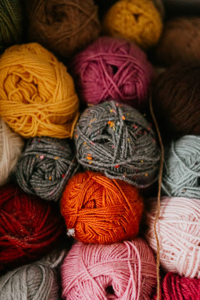istock Colorful yarn skeins close up, stacked 2012164550