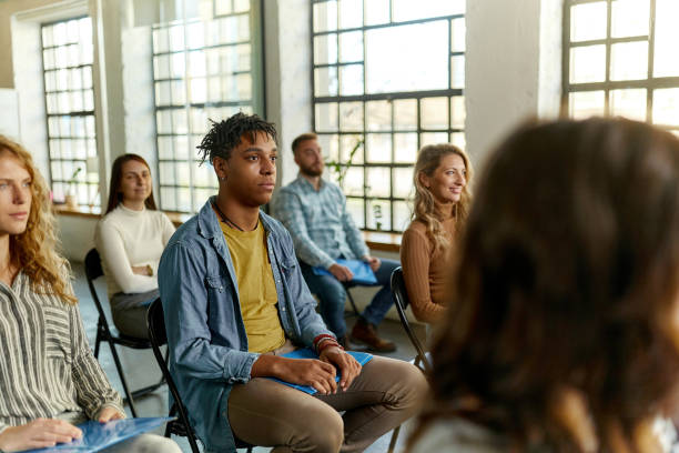 istock Black male freelancer having a seminar with his colleagues in board room. 2012175574