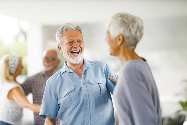 istock Happy mature couple enjoying in dancing on a party. 2012192443