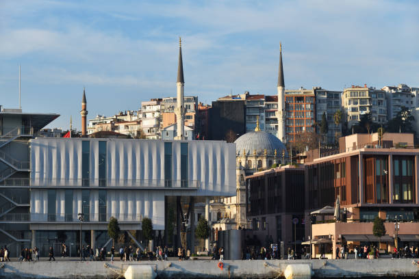 Istanbul, Turkey - December 10, 2023: Beautiful evening view on the Istanbul skyline and city embankment. Galataport Promenade. Turkey