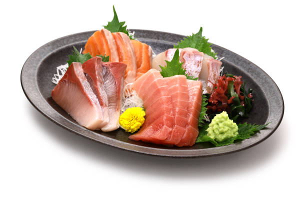 istock assorted sashimi; tuna(medium fatty), salmon, yellowtail, and sea bream. authentic Japanese dining isolated on white background. 2012220253