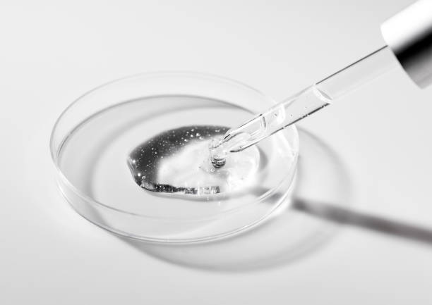 istock Petri dish and dropper on white background. Dripping gel. 2012242231