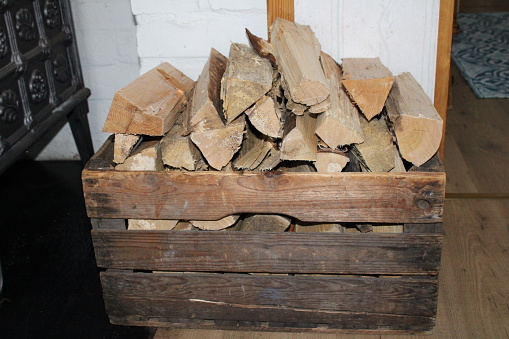 An old wooden box full of firewood