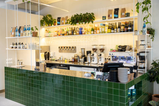 istock Modern cafeteria with green bar counter shelves with drinks 2012247617