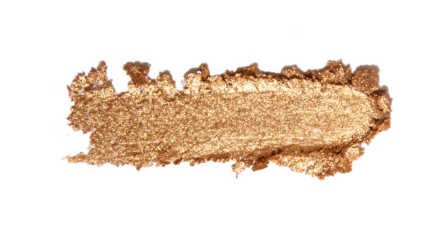 istock smear of gold eyeshadow on empty background 2012267796